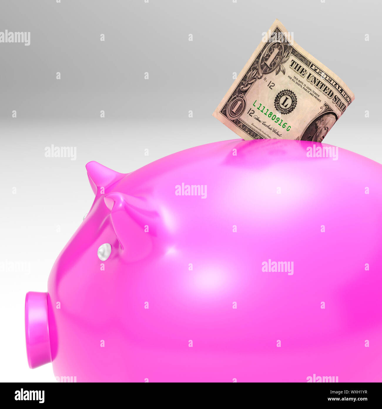 Dollar entrant Piggybank montrant l'épargne et le revenu américain Banque D'Images