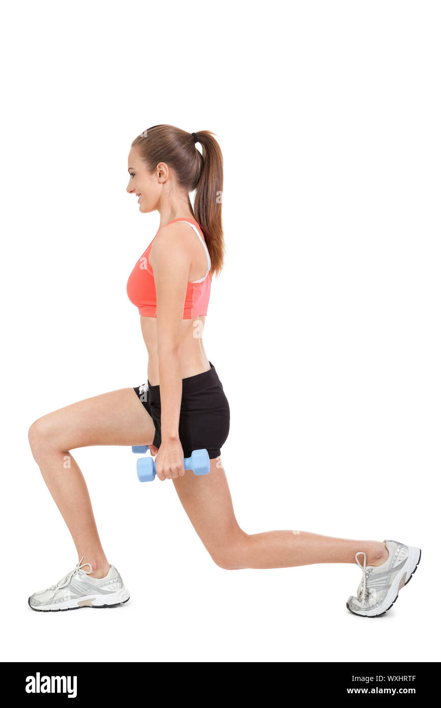 Young attractive woman stretching jambes après isolés de jogging Banque D'Images