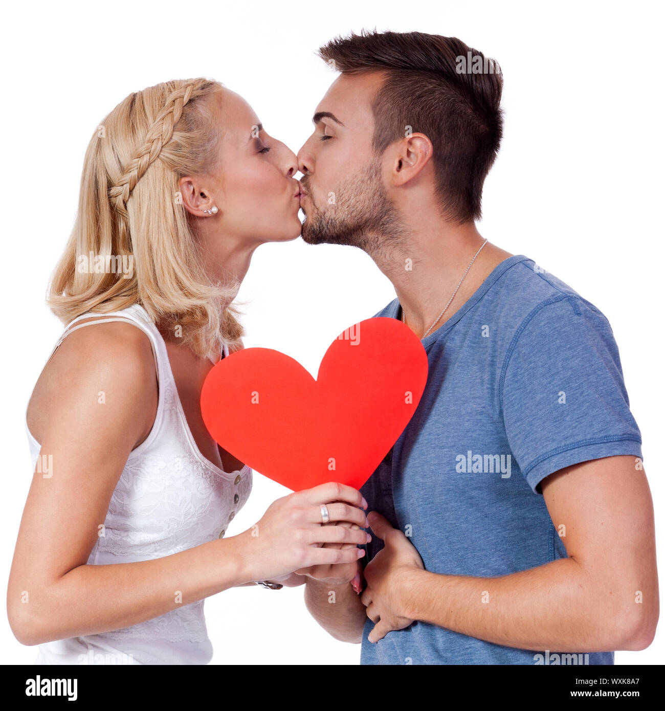 Happy young couple in love with red Heart Valentines Day Banque D'Images