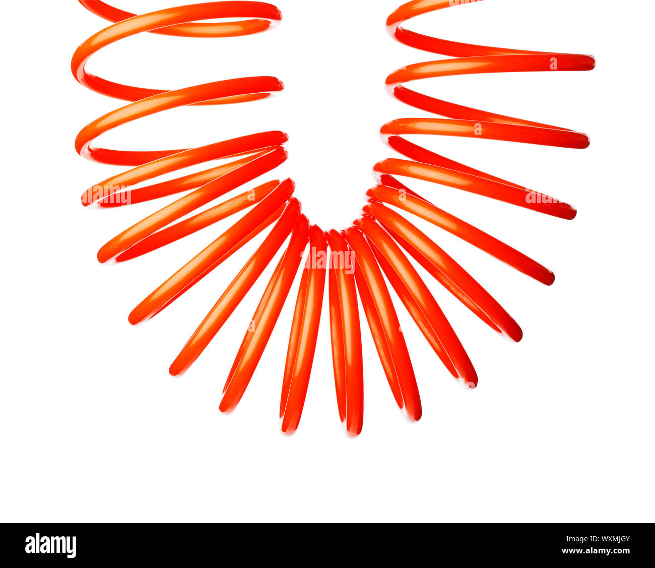 Spirale rouge fine orange flexible d'air utilisé pour outils pneumatiques. Banque D'Images