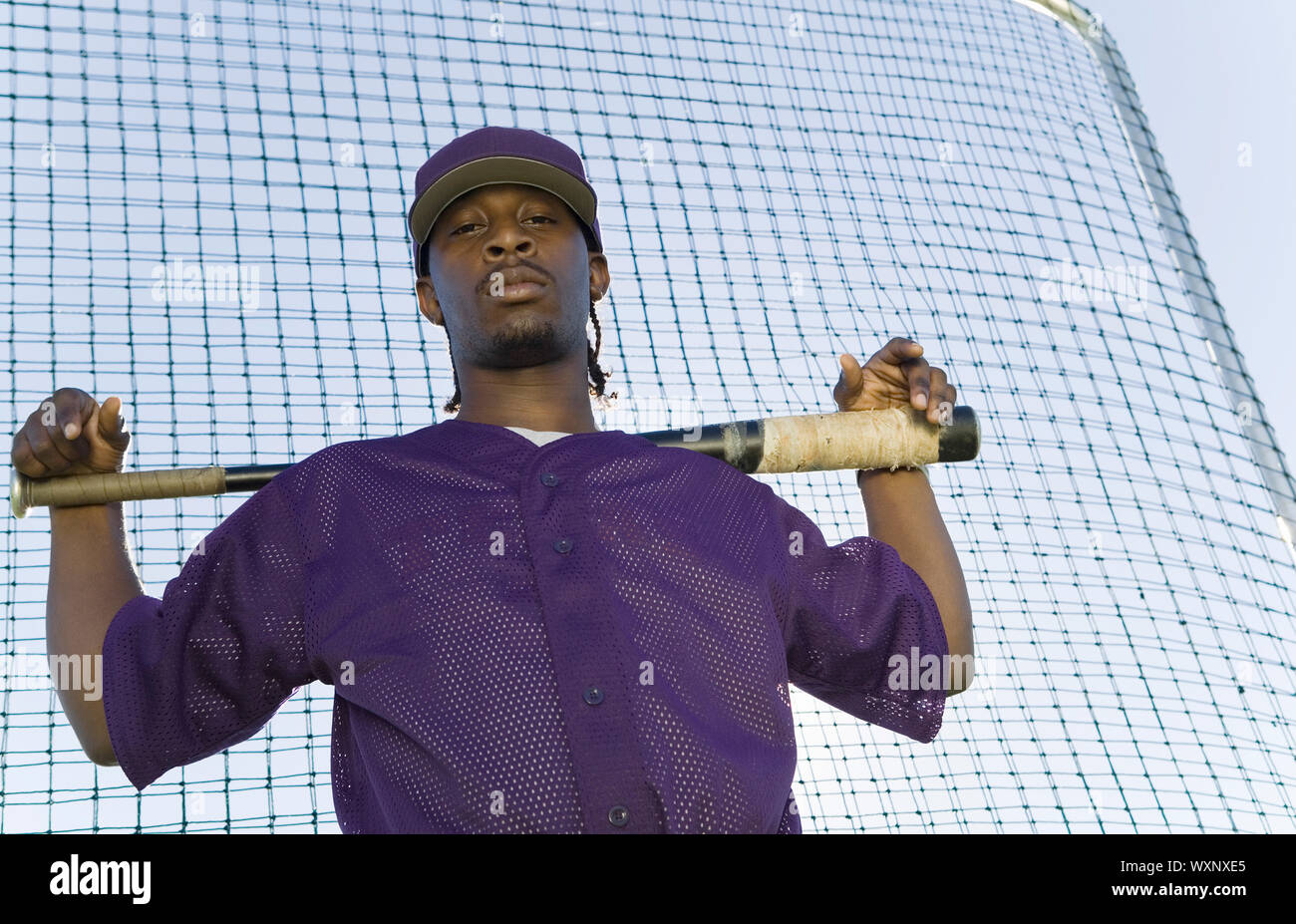 Baseball Batter Holding Bat Au cours de la pratique Banque D'Images