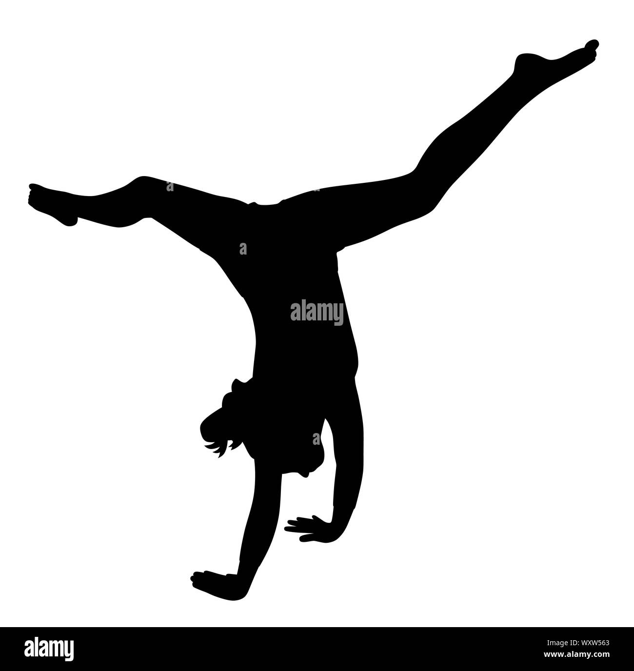 Gymnaste girl making handstand Banque D'Images