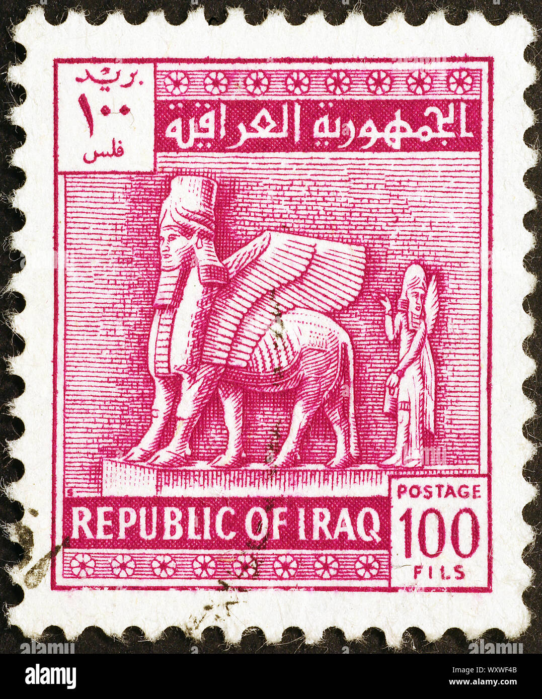 Statue assyrienne sur vieux timbre irakien Banque D'Images