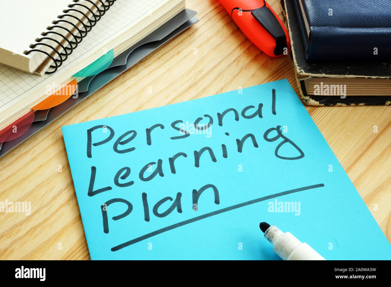 Personal Learning Plan segno con taccuini e prenota. Foto Stock