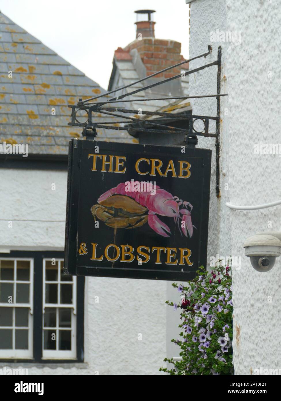 Granchi e aragoste pub Sign in Port Isaac- un segno della Doc Martin troupe cinematografica Foto Stock