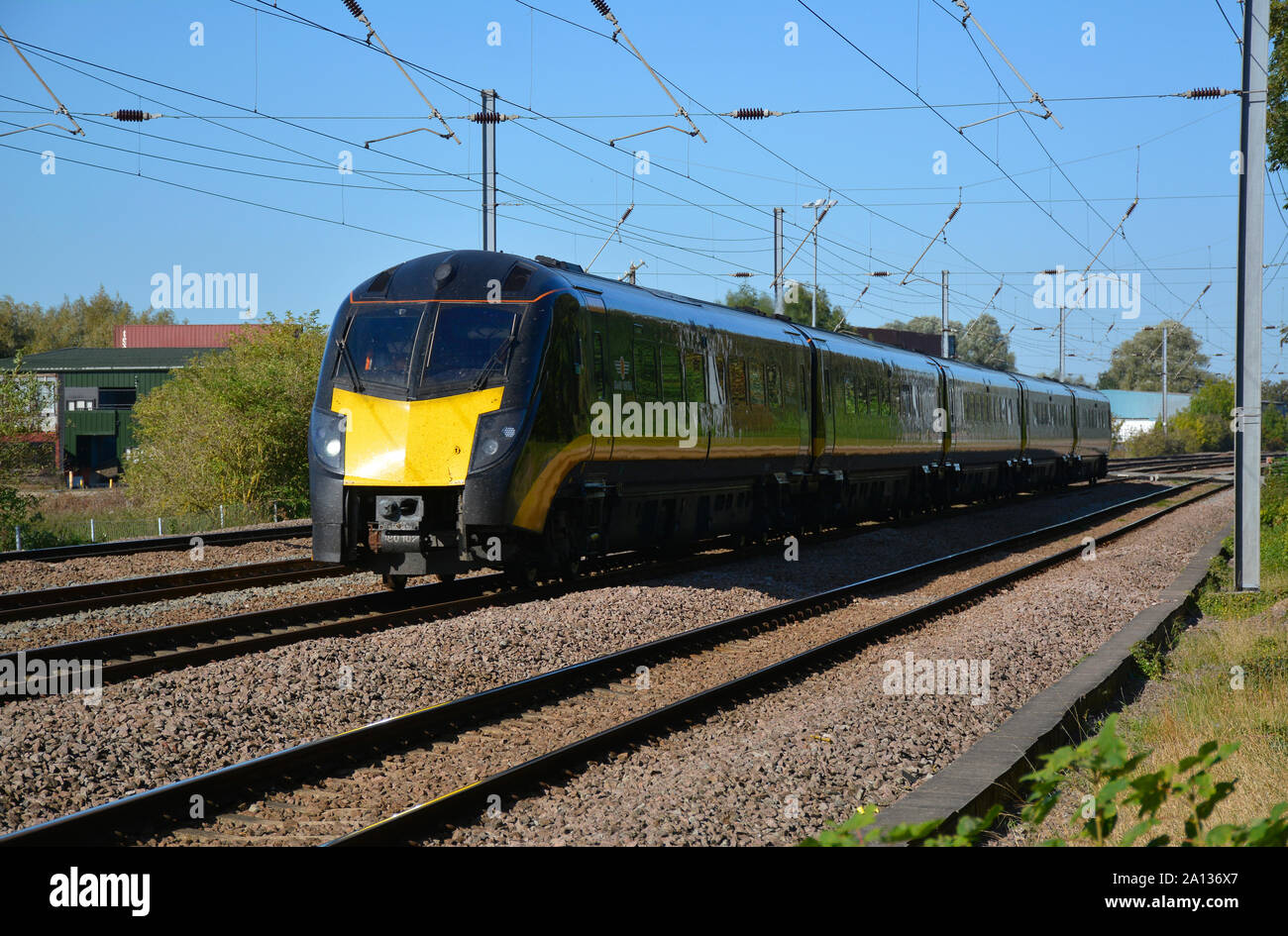 Grand Central classe treni 180 180102 Adelante passa Offord Cluny sulla East Coast Main Line, Cambridgeshire, Regno Unito Foto Stock