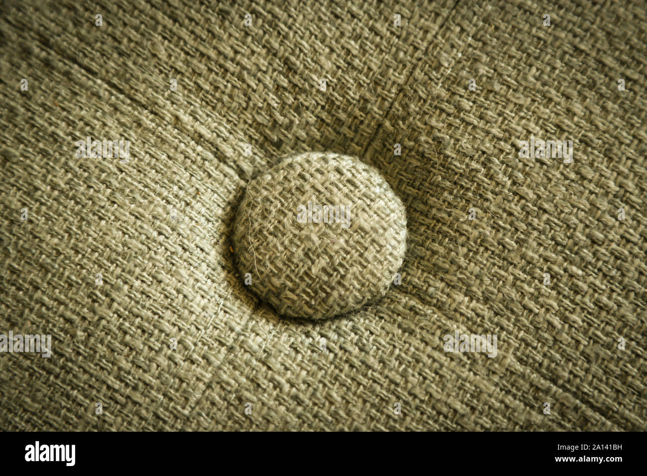 La consistenza del materiale, con profondità di campo - colore Beige con luce vignetta. Foto Stock