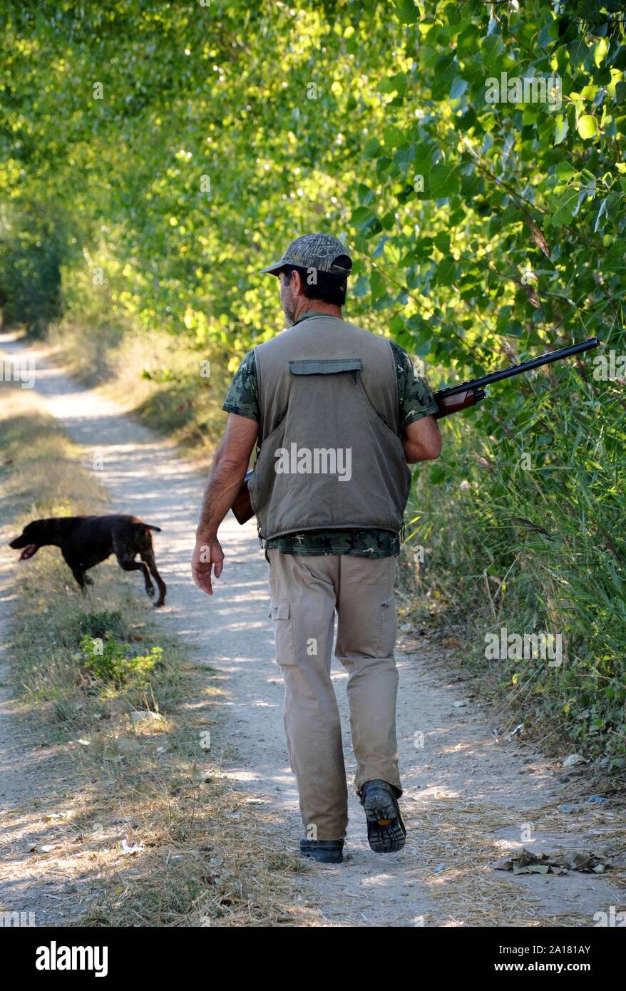 Cacciatore con cane Foto Stock