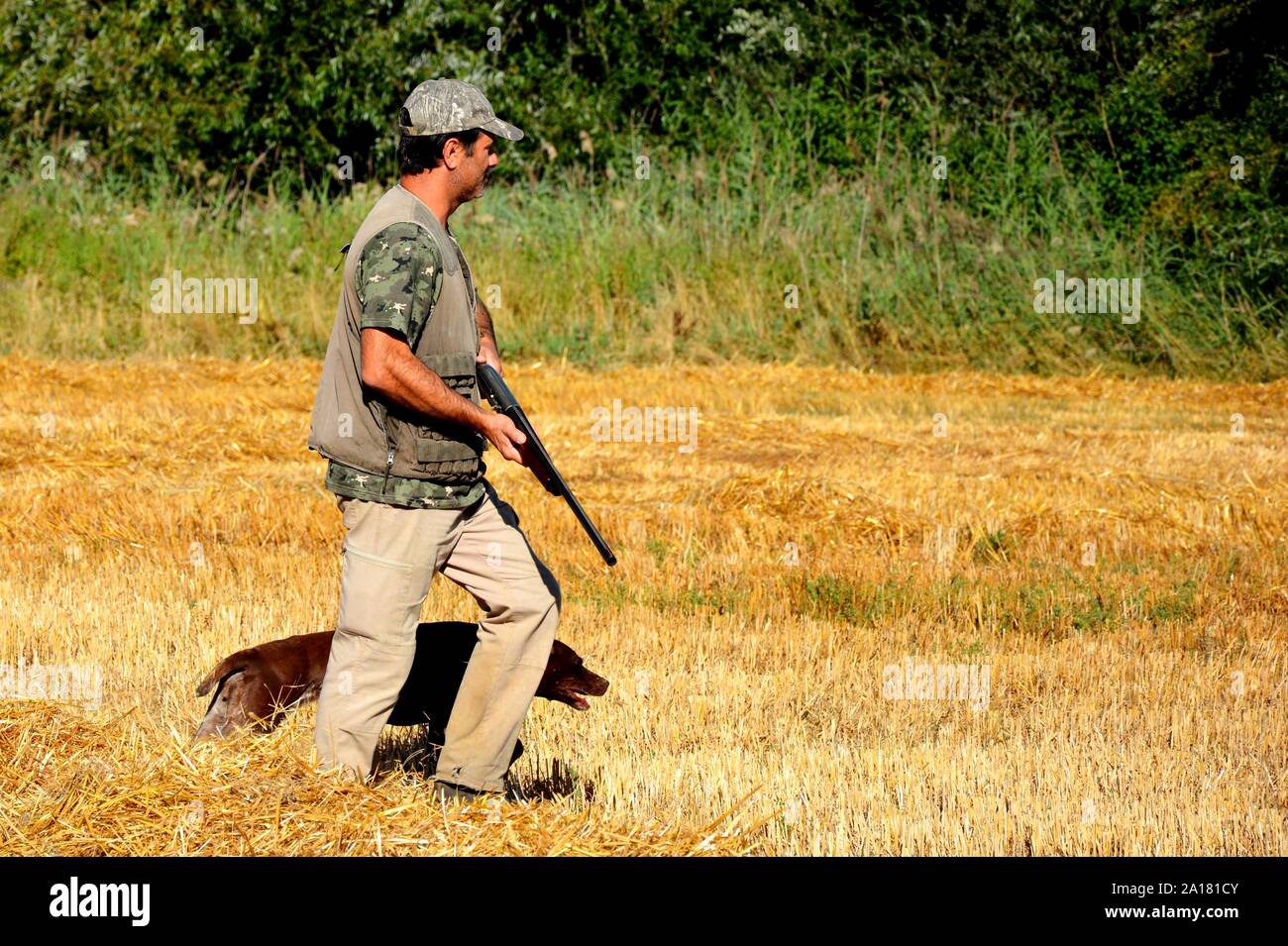 Cacciatore con cane Foto Stock