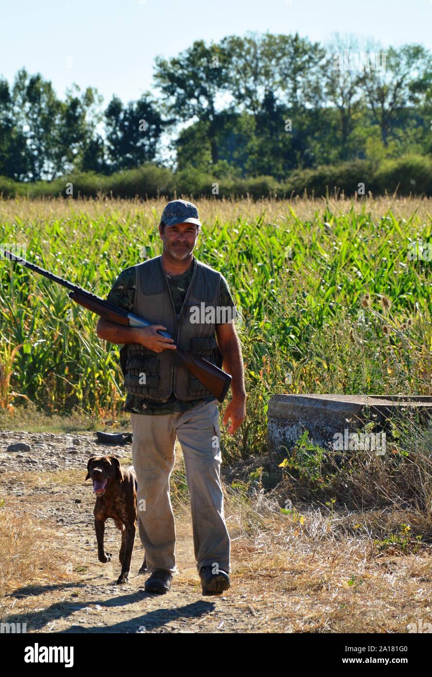Cacciatore con cane Foto Stock