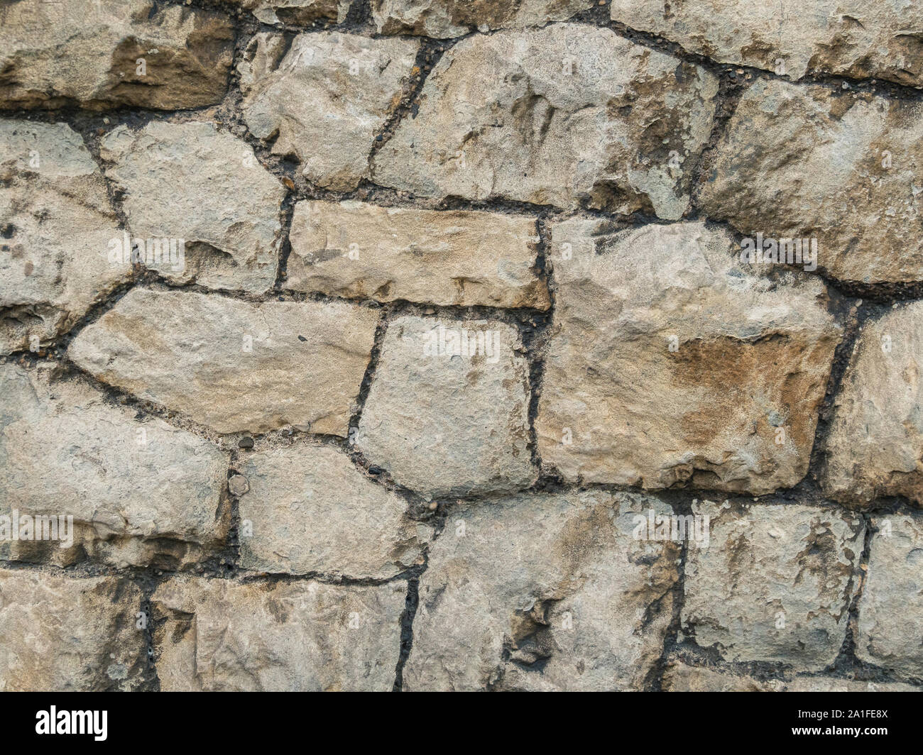 Il vecchio marrone e grigio muro in ciottoli di texture. Foto Stock