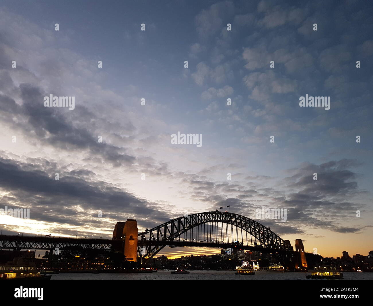 Il Porto di Sydney Harbour Bridge Tramonto Foto Stock