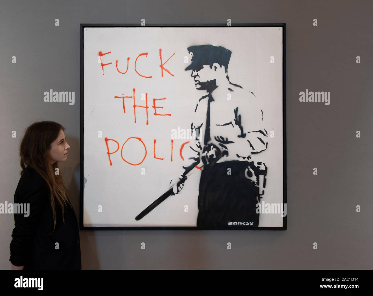 Bonhams, New Bond Street, Londra, Regno Unito. Il 30 settembre 2019. Anteprima della vendita arte contemporanea. Immagine: Banksy (British, b. 1975) Untitled (F--k la polizia) 2000. Preventivo: £450,000-650,000. Credito: Malcolm Park/Alamy Live News. Foto Stock