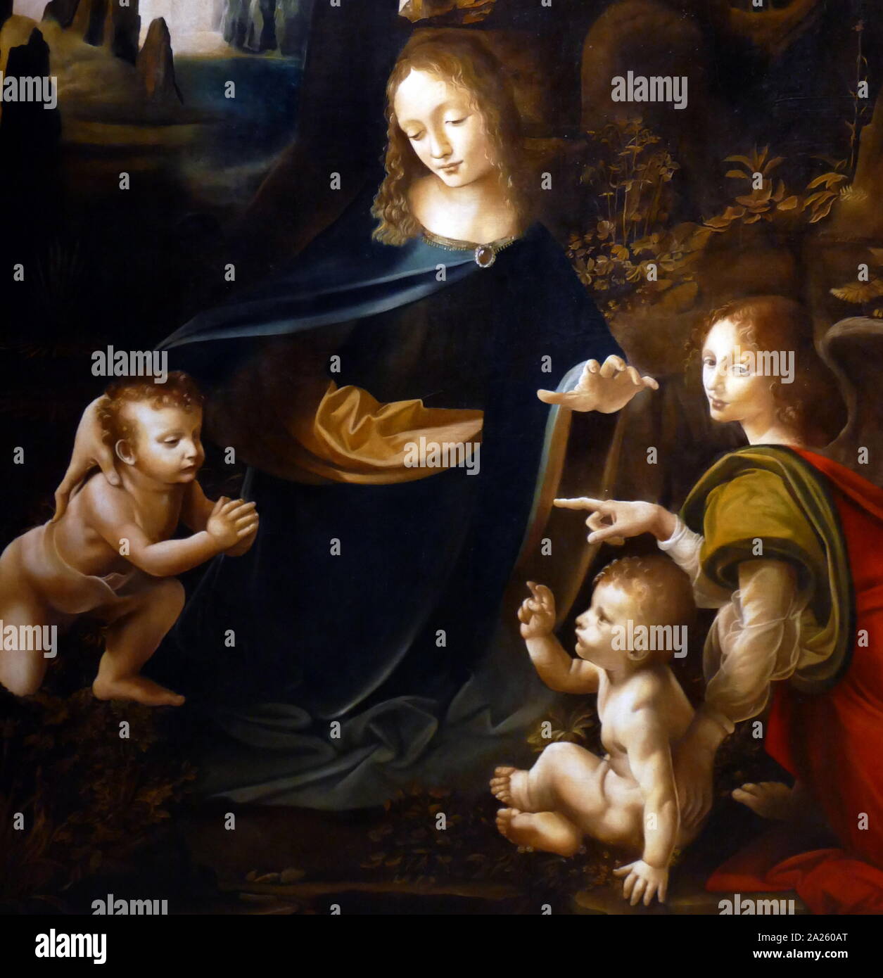 Dettaglio da "La Vergine delle Rocce" (Madonna delle rocce), uno dei due versioni dipinta da Leonardo da Vinci, dello stesso soggetto e di una composizione che è identica tranne che per alcuni dettagli significativi. Questa è la versione al Louvre di Parigi. originariamente dipinta su pannello di legno, ma trasferita su tela. Entrambi i dipinti mostrano la Madonna e il bambino Gesù con il Bambino di Giovanni Battista e un angelo, in una impostazione roccioso che dà i dipinti del loro nome usuale. Foto Stock