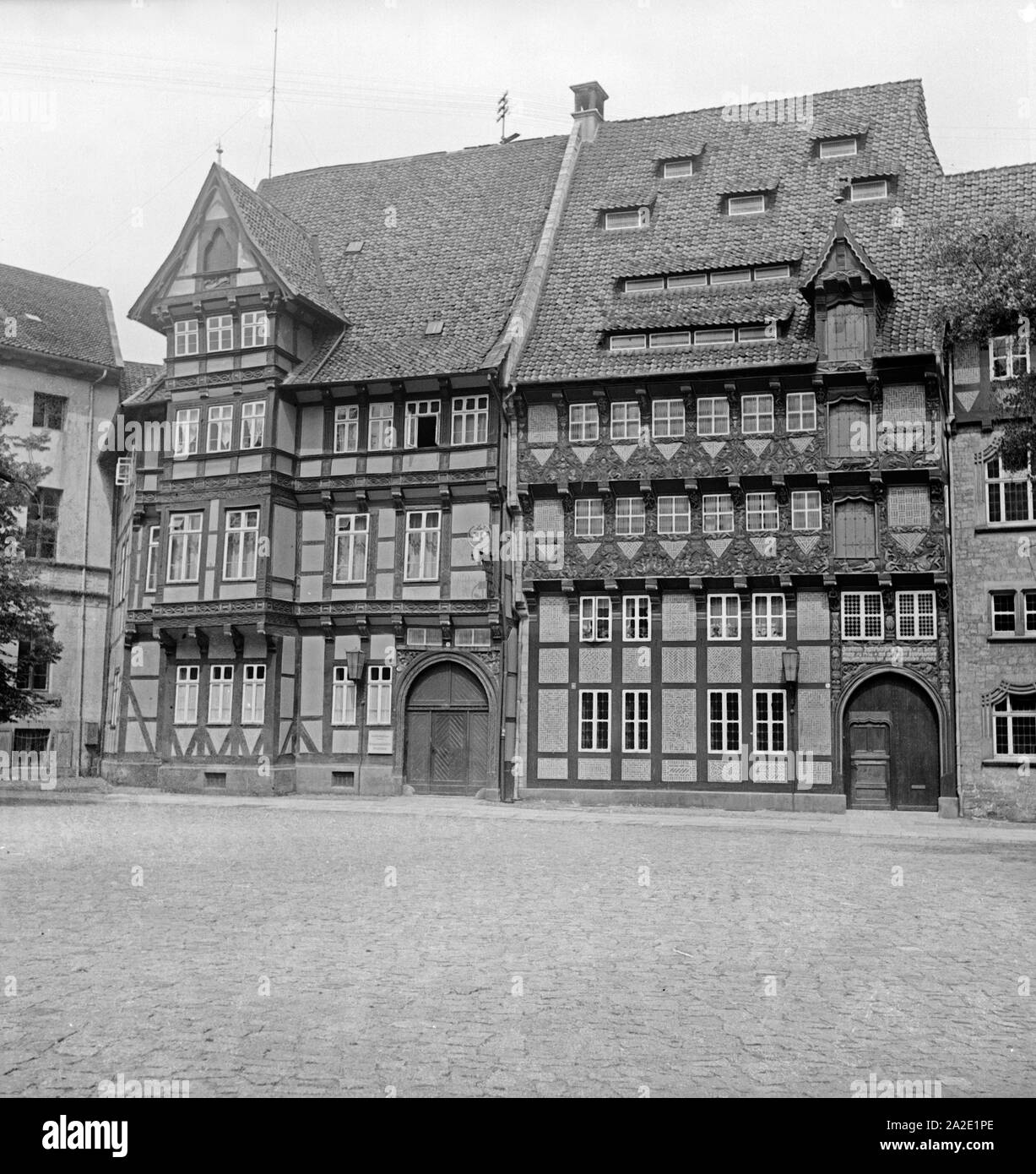 Eine Gruppe von Fachwerkhäusern in der Altstadt von Braunschweig, Deutschland 1930er Jahre. Un gruppo di case con travi di legno in corrispondenza della vecchia città di Braunschweig, Germania 1930s. Foto Stock