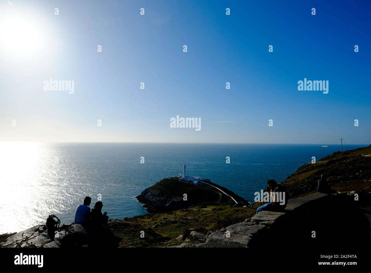 Sud pila faro Anglesea Galles del nord Isole britanniche in prima serata sole dell'estate indiana nel Regno Unito Foto Stock