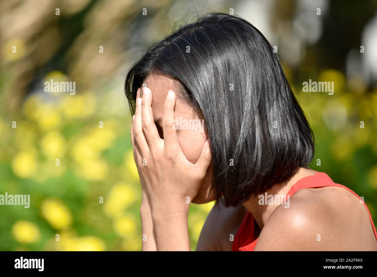 Un infelice donna femmina Foto Stock