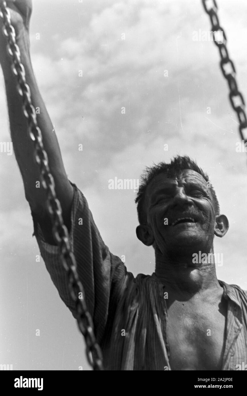 Männer bei der Arbeit, Deutsches Reich 1930er Jahre. Gli uomini al lavoro, Germania 1930s. Foto Stock
