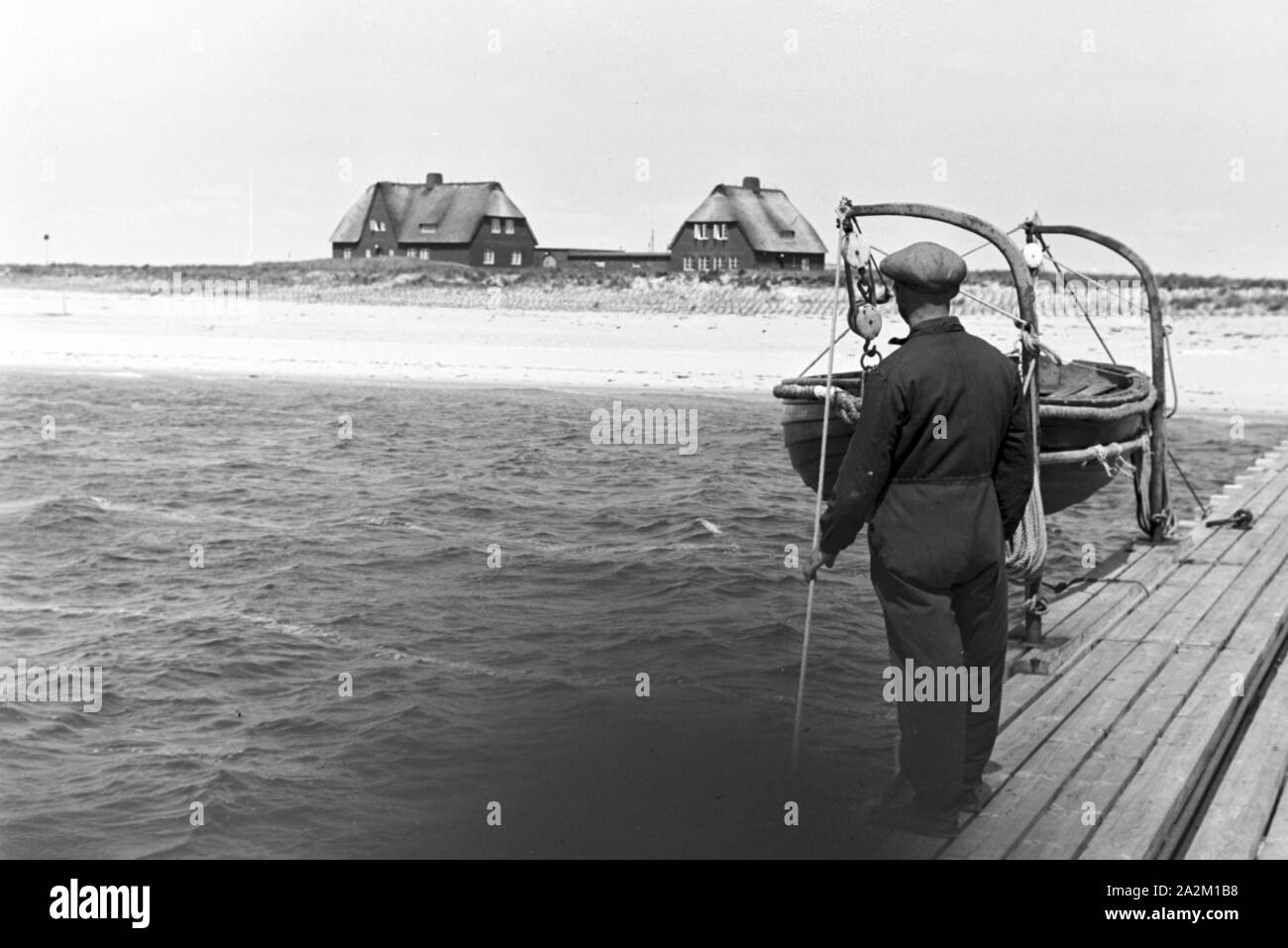 Fischer bei der Arbeit, Deutsches Reich 1930er jahre. I pescatori a lavoro, Germania 1930s. Foto Stock