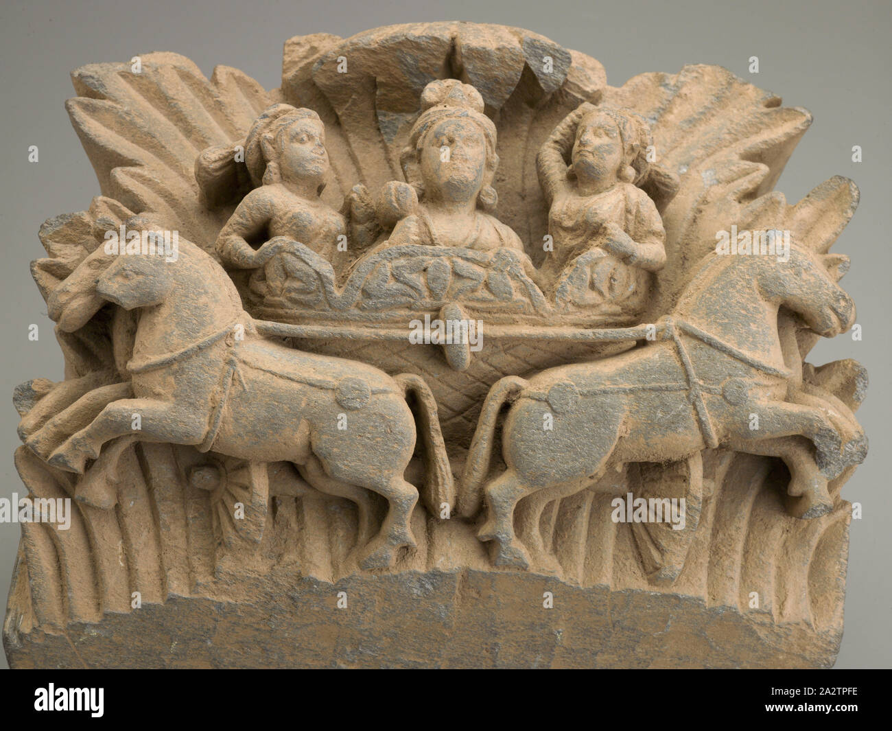 Surya, il dio del sole, 200s, pietra, 11 x 10 in., Arte Asiatica Foto Stock