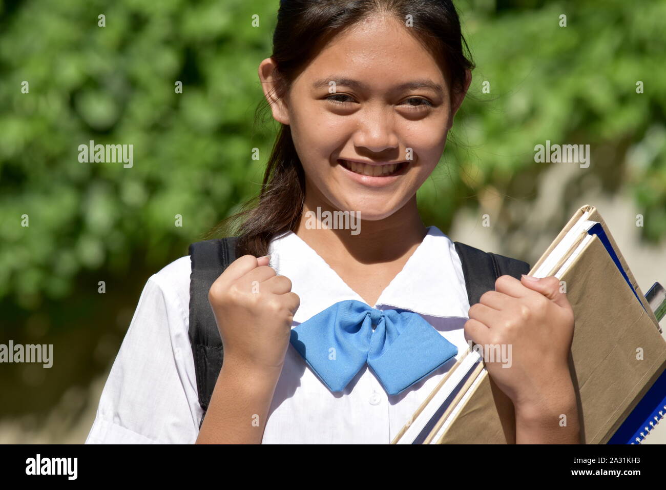 Un orgoglioso studentessa Foto Stock