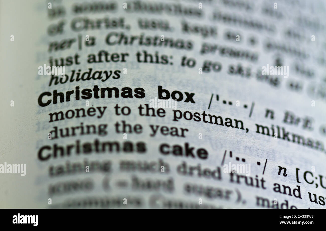 La parola Natale box definizione nel dizionario vecchio sotto la lente di ingrandimento Foto Stock
