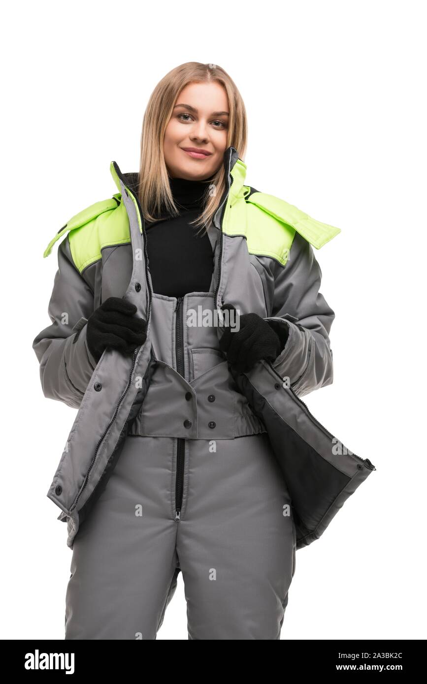 Bionda in abiti da lavoro e guanti vista isolata Foto Stock