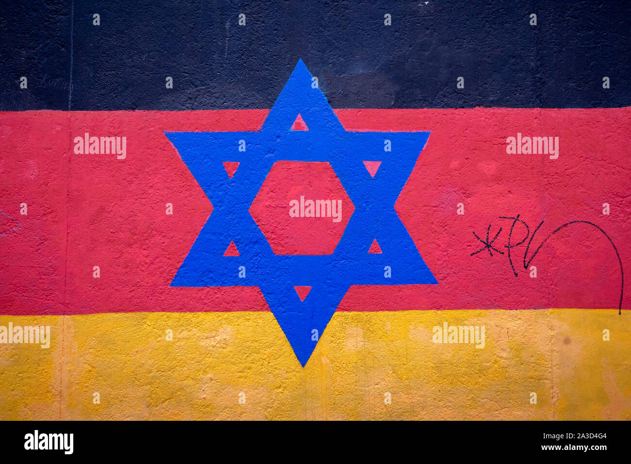 Jewish simbolo dipinto sulla bandiera tedesca Foto Stock