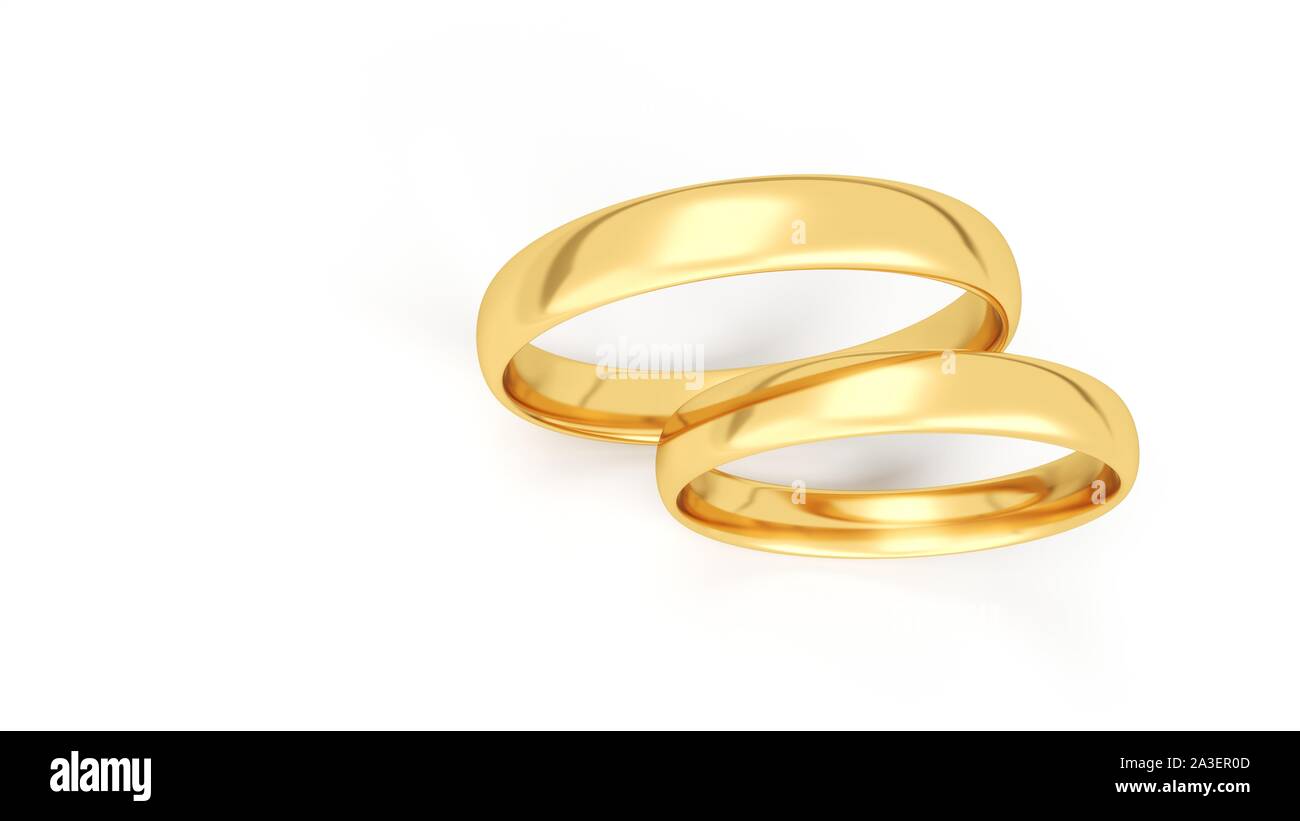 Oro anelli di nozze isolati su sfondo bianco. Foto Stock