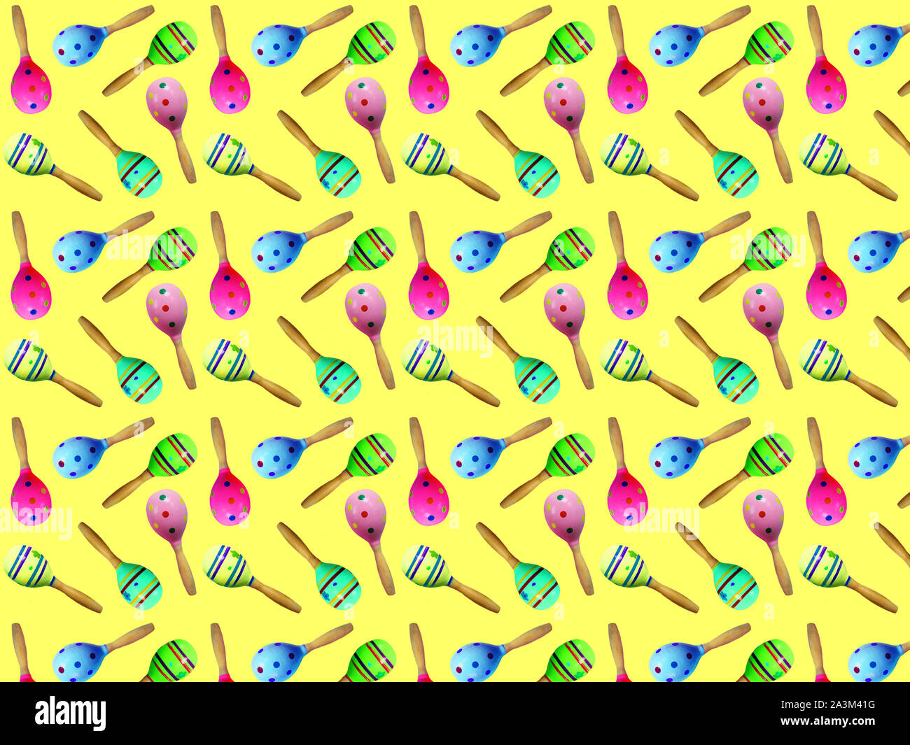 Seamless patern sonaglio (TOY) per un bambino su uno sfondo giallo. Sfondo per tessuto. Foto Stock