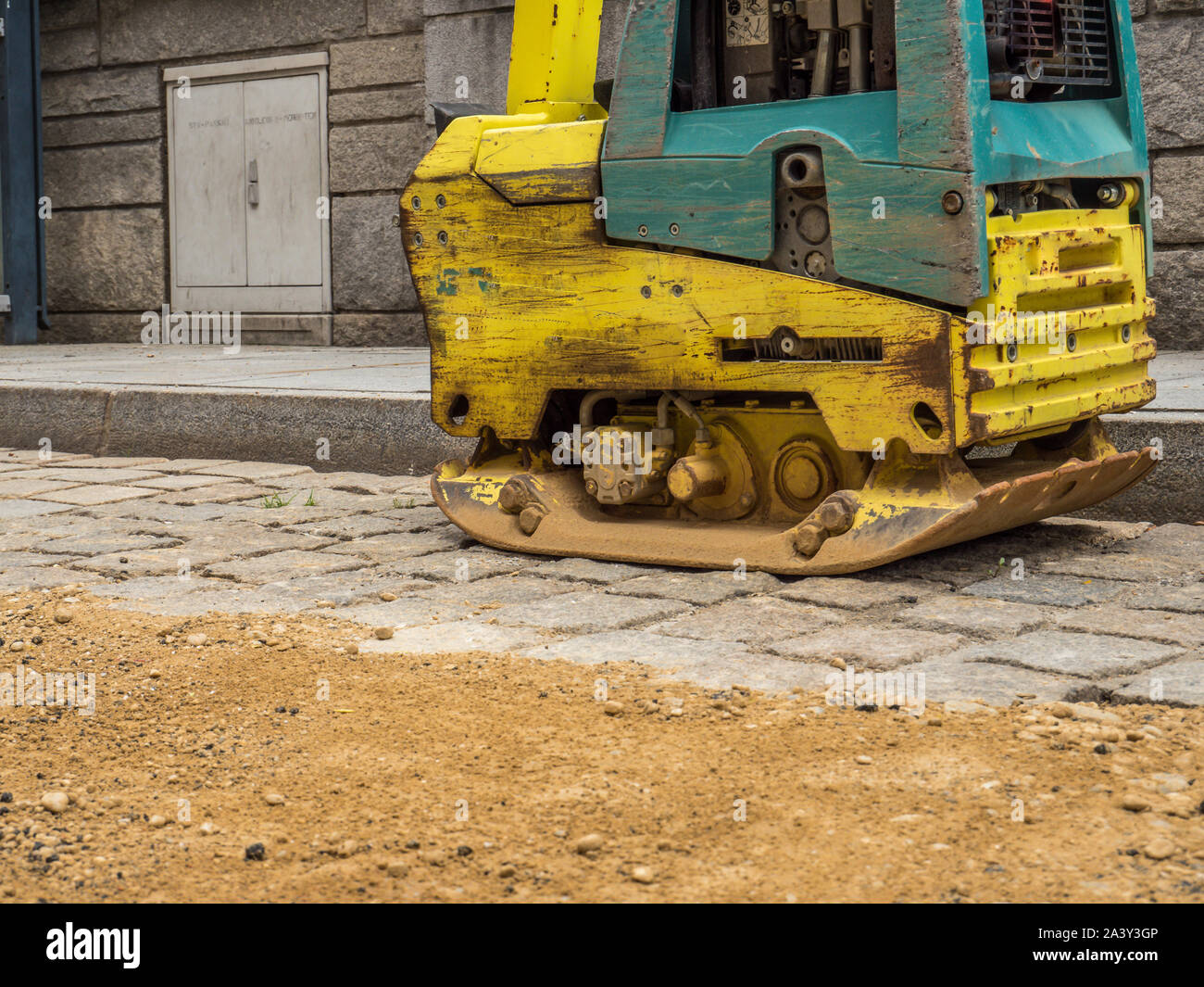 La piastra vibrante sito di costruzione Foto Stock