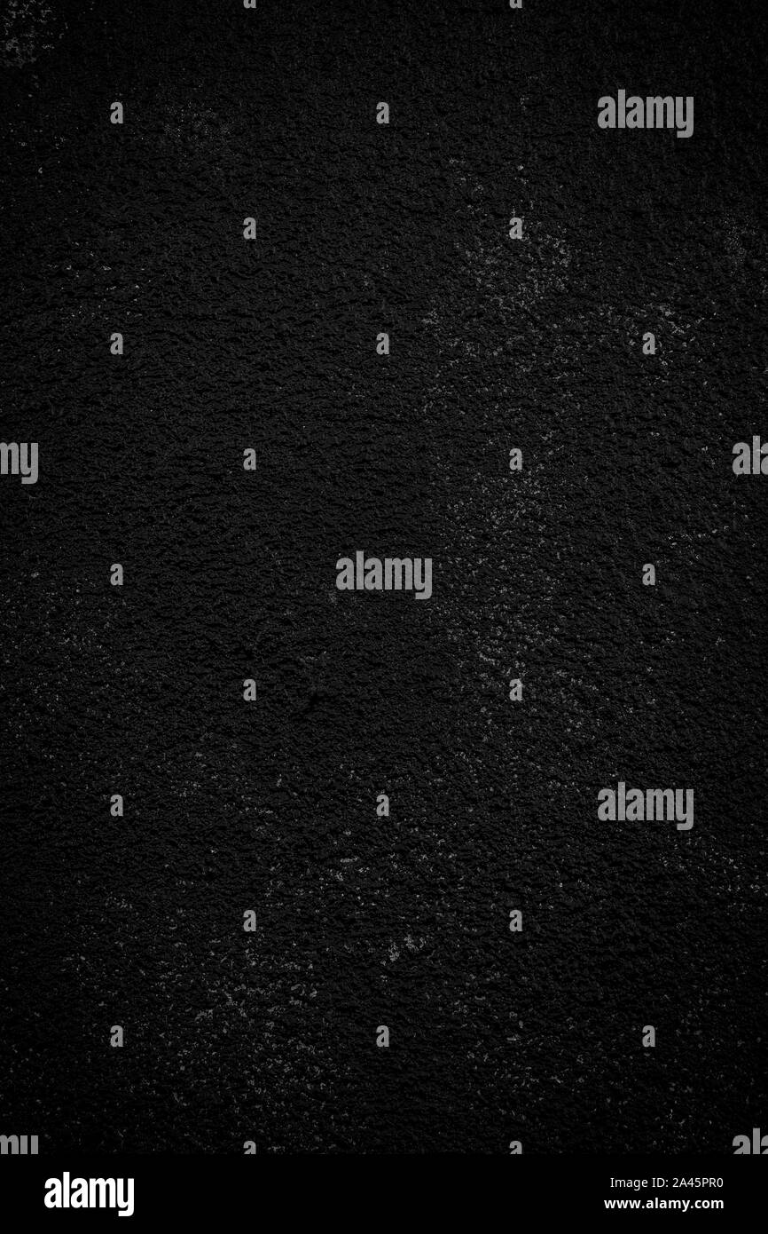 Close-up di un intonacate e dipinte di parete ruvida. Dark alta risoluzione full frame sfondo strutturata in bianco e nero con la vignettatura. Foto Stock