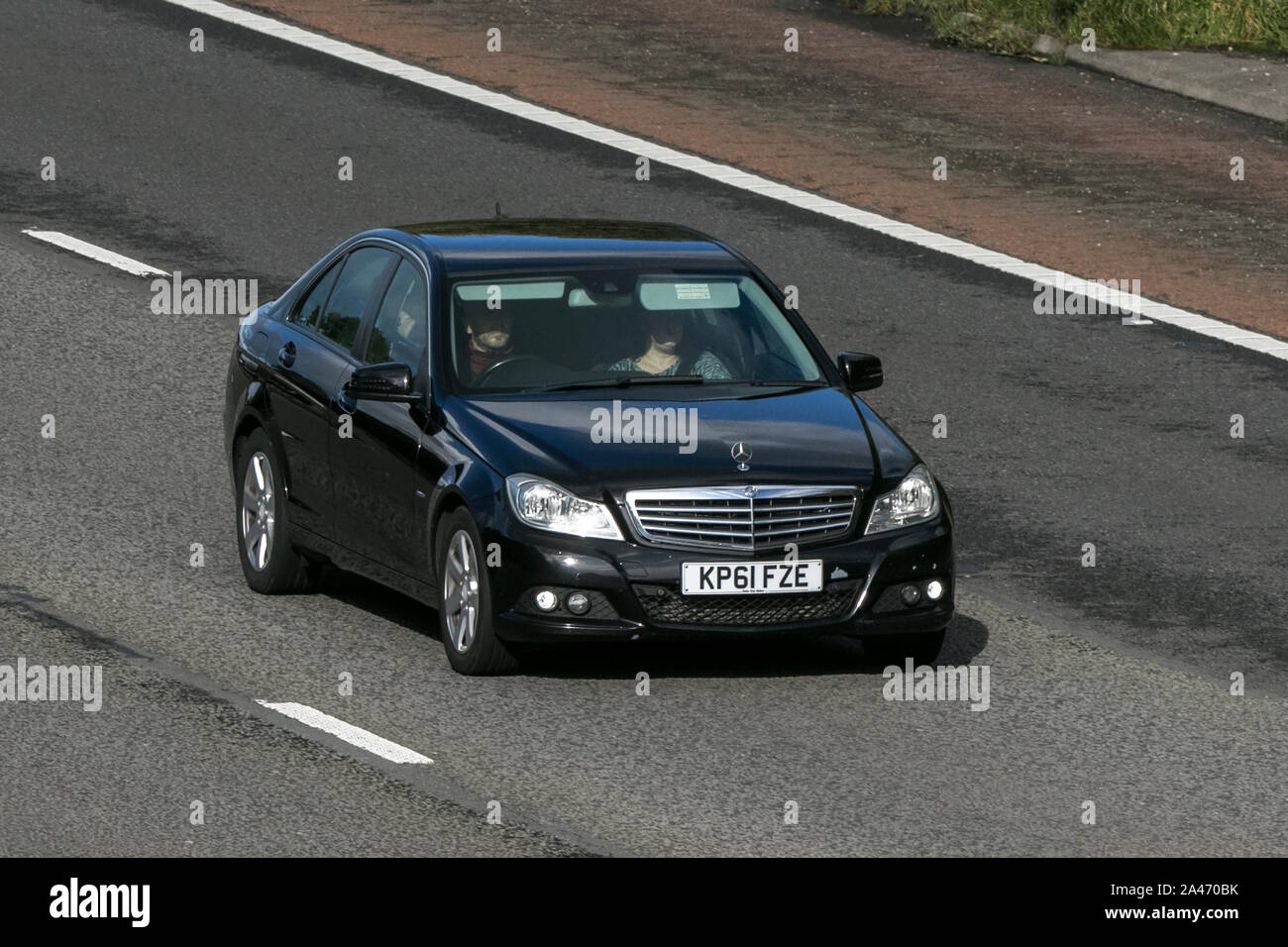 2011 Mercedes-Benz C200 SE ED 125 CDI Blueef; Viaggiare sulla autostrada M6 vicino a Preston nel Lancashire, Regno Unito Foto Stock