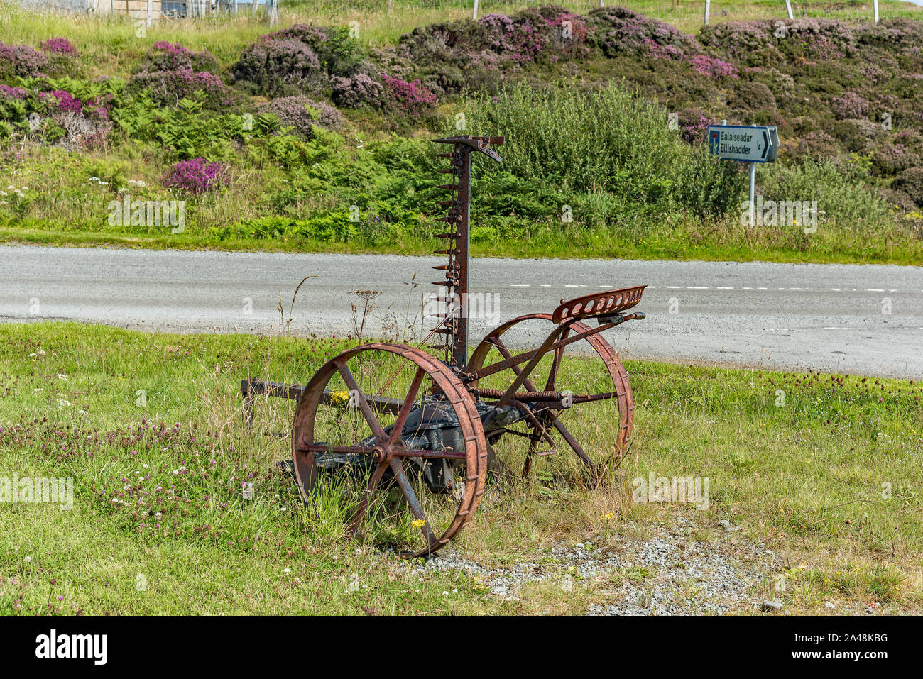 Antique McCormick Horse-Drawn tosaerba di fieno, Ellishadder, Isola di Skye Foto Stock