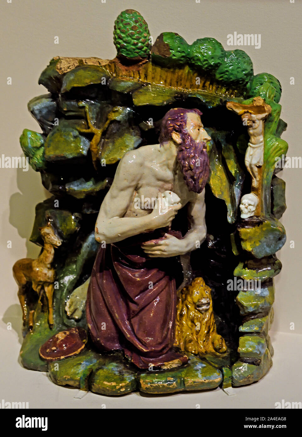 La scultura in terracotta smaltata policroma rinascimentale "San Girolamo nel deserto" (Saint Jérôme au désert, circa 1500–1525) di Giovanni della Robbia, esposta al Museo del Louvre a Parigi, Francia. San Girolamo penitente nel deserto 1515, Giovanni della Robbia, 1469-1530, Firenze, Italiano, Italia, (Scultore del primo Rinascimento) Foto Stock