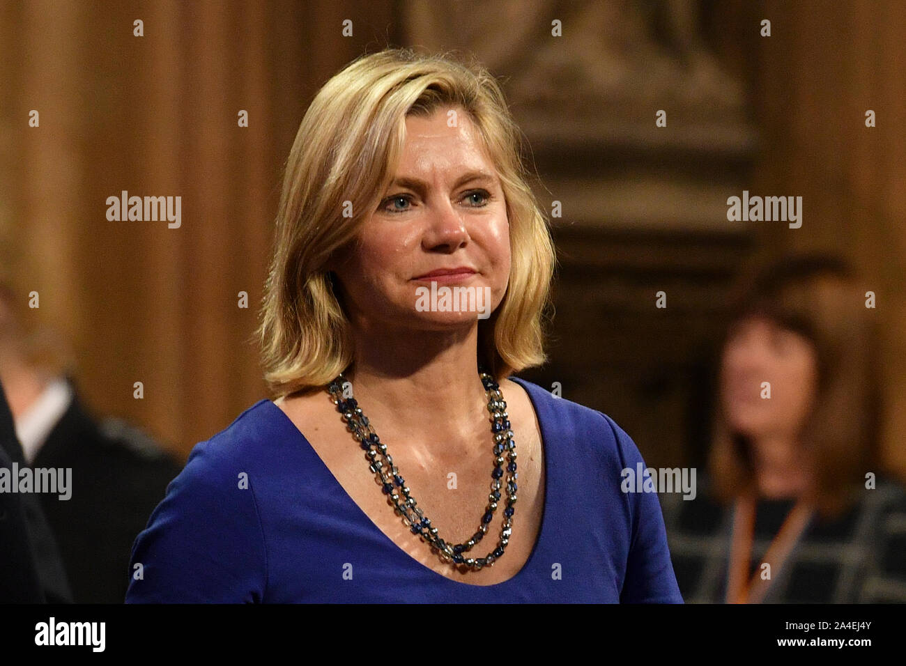 Justine Greening nella hall centrale come lei cammina torna alla House of Commons regina dopo la parola durante lo stato apertura della cerimonia del Parlamento europeo a Londra. Foto Stock