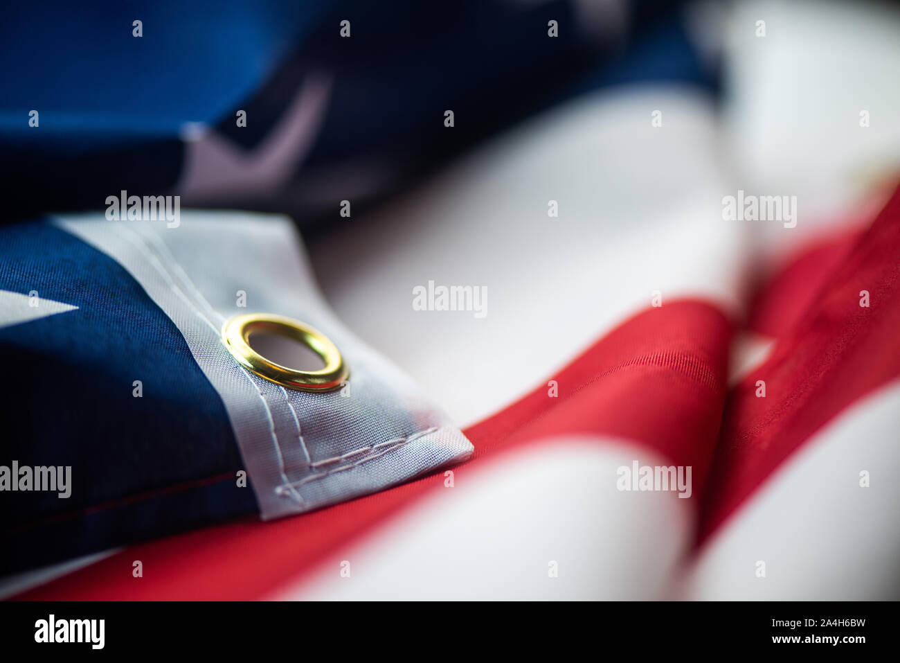 Primo piano della bandiera americana sulla pianura macro sfondo Foto Stock