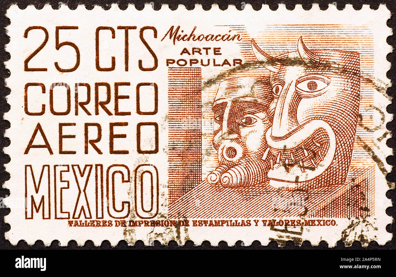 Maschere di Michoacàn sul vecchio mexican francobollo Foto Stock