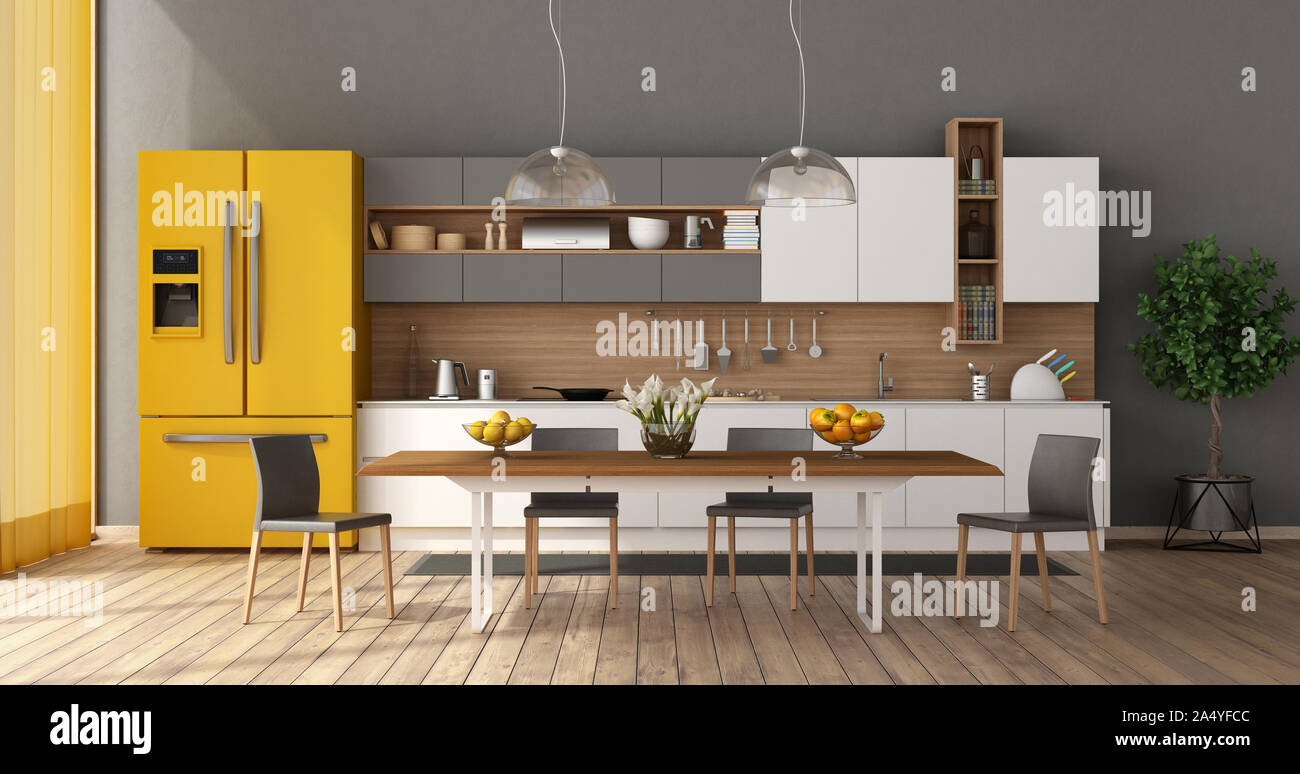 Moderno e di colore bianco e grigio cucina con tavolo da pranzo e frigorifero giallo - il rendering 3D Foto Stock