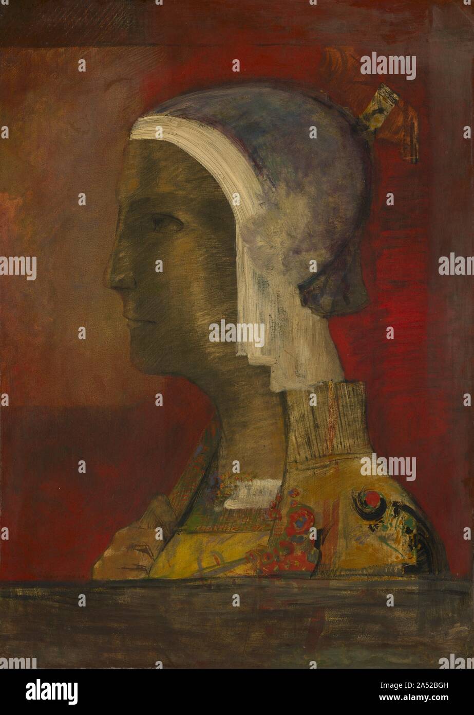 Testa simbolico, c. 1890. Uno di Redon's temi preferiti del 1880 e 1890 è stata una testa umana rappresentata nel profilo. Questo motivo è venuto dalle sue rappresentazioni di teste tagliate, spesso effettuati aloft sulle ali, pubblicato in dell'artista album prima di stampe, Dans le R&#xea;ve (1879). In queste immagini, la separazione della testa dal corpo simboleggia lo spirito liberato dal mondo materiale. Esso suggerisce inoltre una metafora per abbandonare la realtà fisica per il realm interno dei sogni, fantasia, e poetico reverie. Questo dipinto trasmette l'idea di perfezionamento attivo-girando la visione da incorniciare la testa in una serie Foto Stock