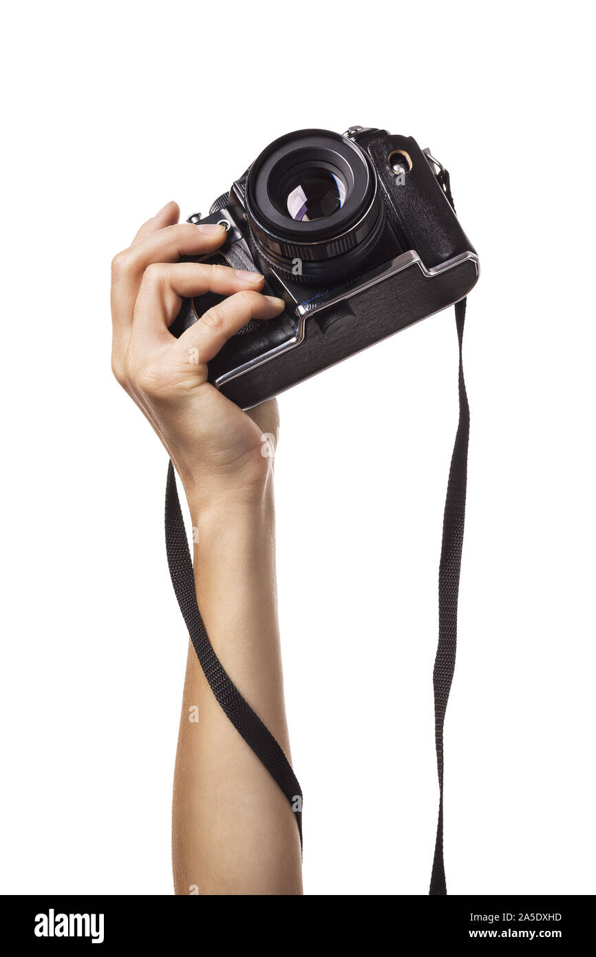 Alzata fino a mano femmina trattiene una telecamera isolata su sfondo bianco Foto Stock