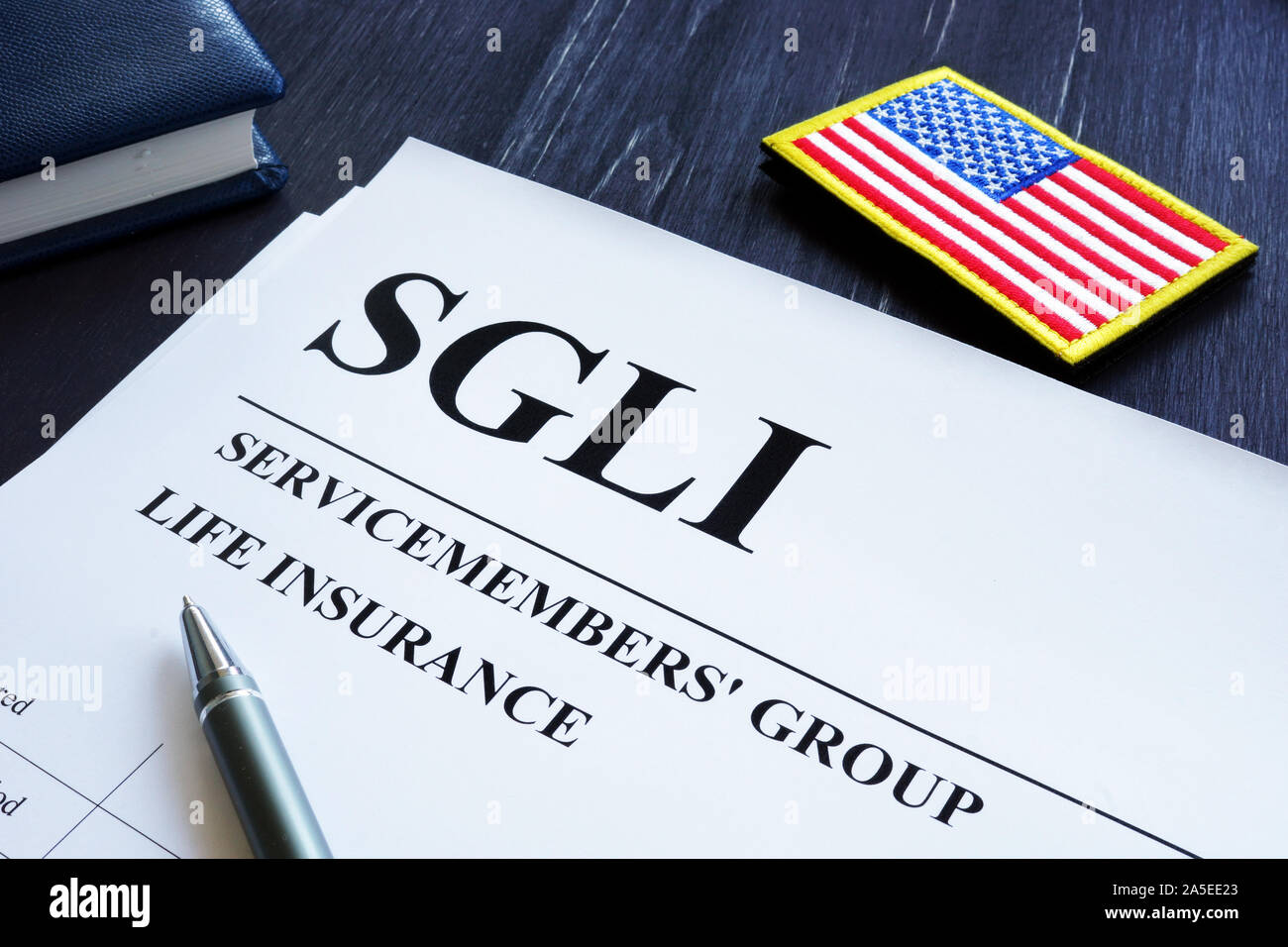 Servicemembers di gruppo di assicurazione sulla vita politica SGLI e penna. Foto Stock