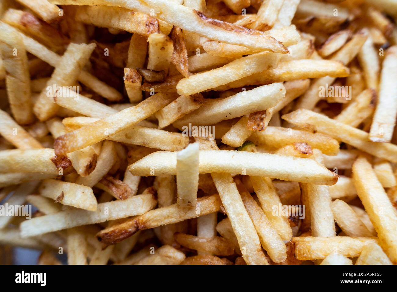 Una vista ravvicinata della fecola di patate chipstick patatine stile. Foto Stock