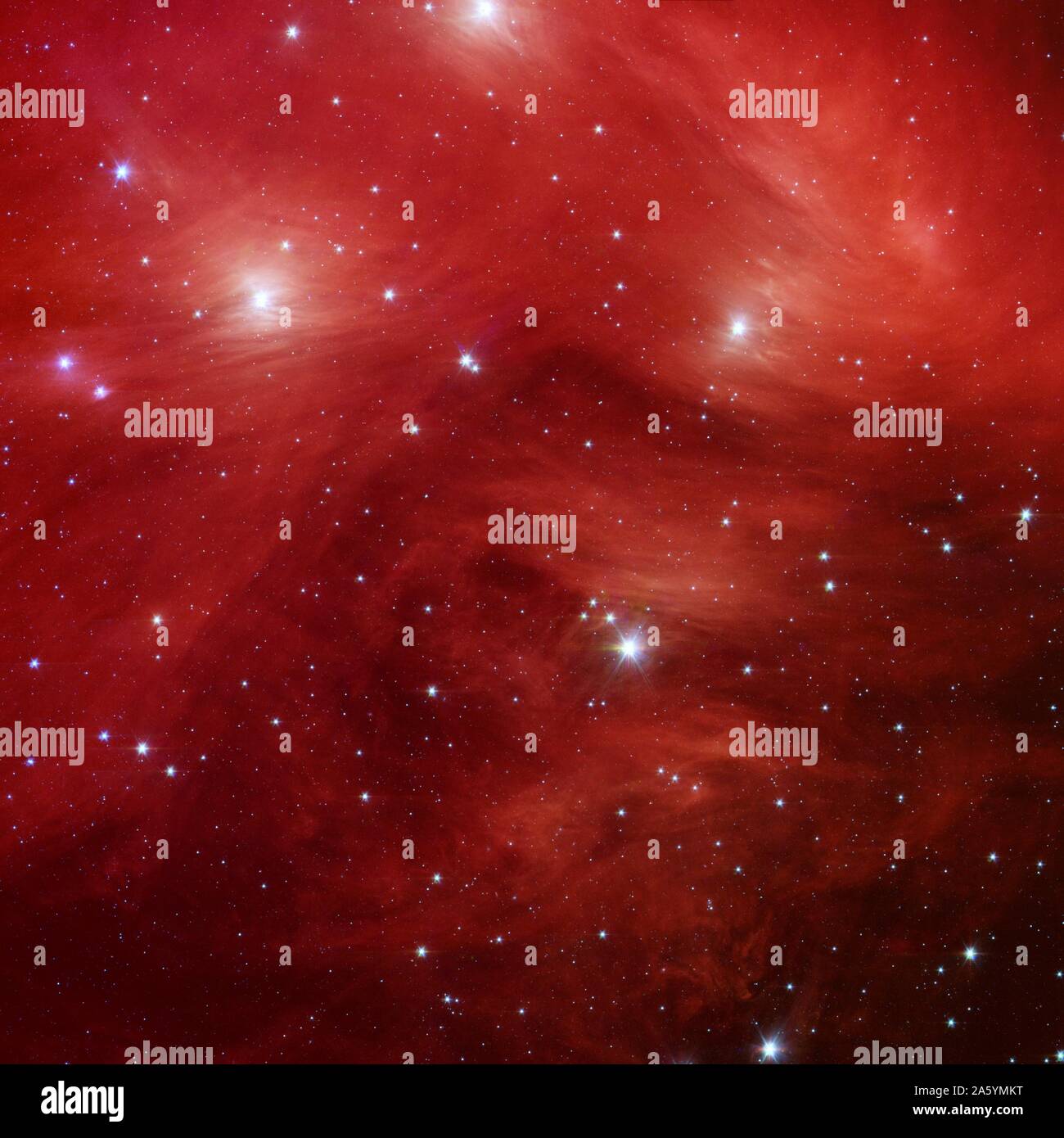 Le Sette sorelle, noto anche come le Pleiadi star cluster, situato a più di 400 anni luce di distanza nella costellazione del Toro. Telescopio spaziale Spitzer. Foto Stock