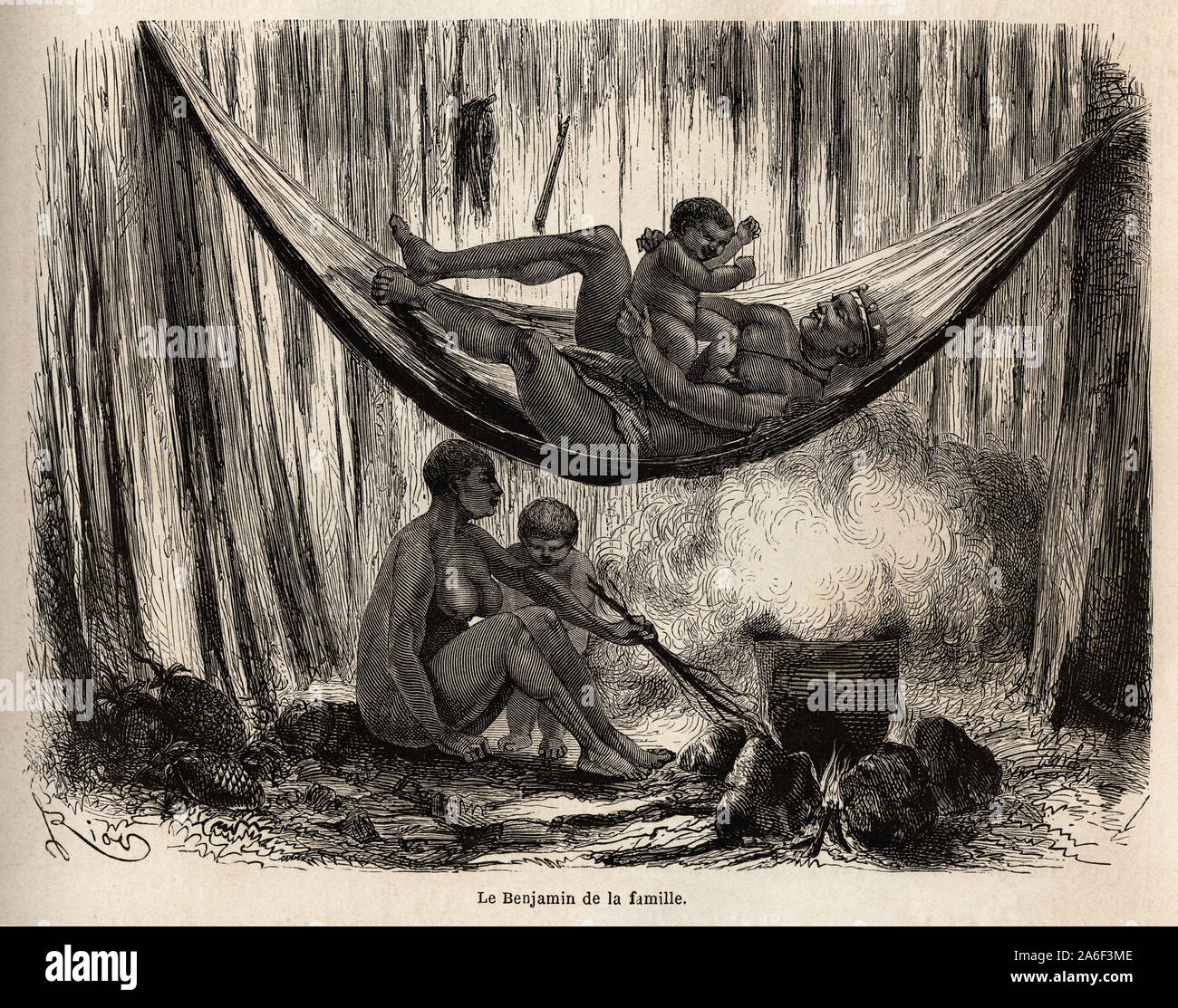 Scena de la vie familiale chez les indiens Yahuas de la Mission de San Jose ( Perou), l'homme joue avec son dernier ne dans un hamac, pendente que la f Foto Stock