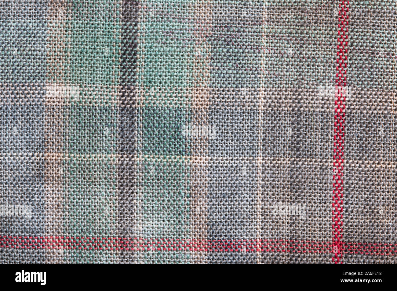 Chiusura del materiale tartan, colorata che mostra le linee verticali e orizzontali, e il tessuto di consistenza del materiale. Foto Stock