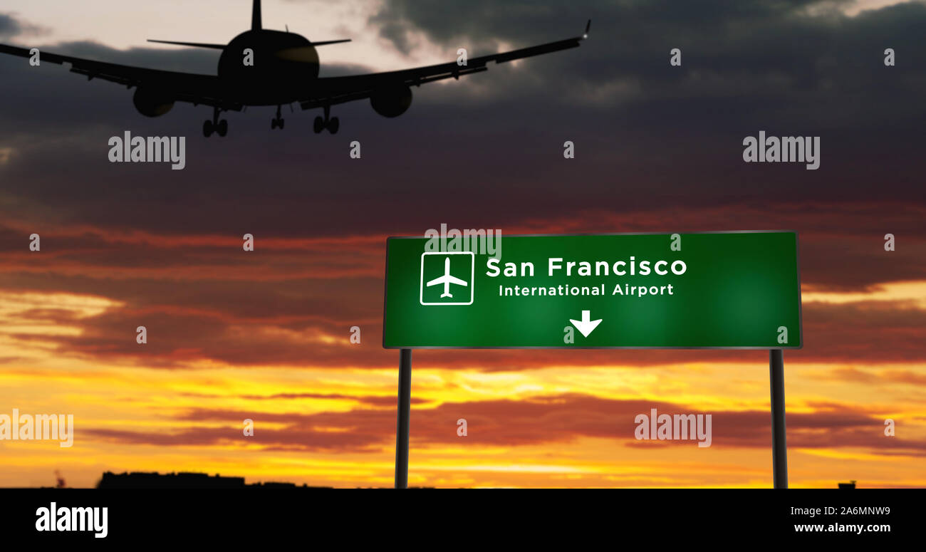 Silhouette di aeroplano di atterraggio in San Francisco, California, Stati Uniti. Città arrivo con direzione aeroporto di cartello e il tramonto in background. Viaggio Foto Stock
