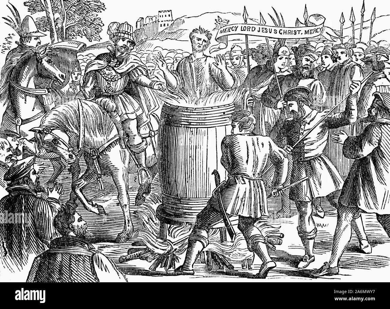 John Badby (morto nel 1410), uno dei primi martiri Lollard è stato condannato da Worcester tribunale diocesano per la sua negazione della transustanziazione. Egli ha sostenuto che quando Cristo seduti a cena con i suoi discepoli non aveva il suo corpo nella sua mano per distribuire e che "se ogni host consacrato all altare erano il corpo del Signore, poi ci essere 20.000 dèi in Inghilterra." Un ulteriore corte in St Paul's, London, presieduta dall Arcivescovo Thomas Arundel e suo cognato William, Barone de Ros, condannato ad essere bruciato in Smithfield, il torneo terreno appena fuori le mura della città. Foto Stock