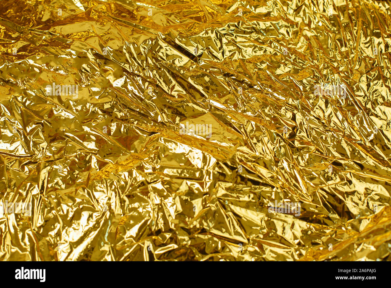 Foglia oro texture di sfondo con scintillante accartocciata superficie  irregolare Foto stock - Alamy