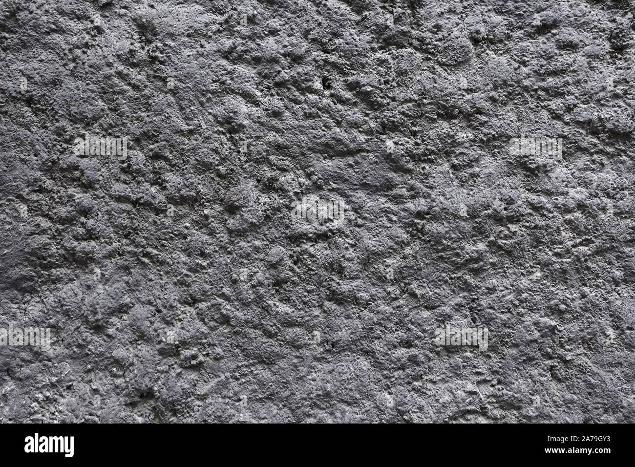 Grigio solidificato raffreddato di lava vulcanica come sfondo a trama vista orizzontale closeup Foto Stock